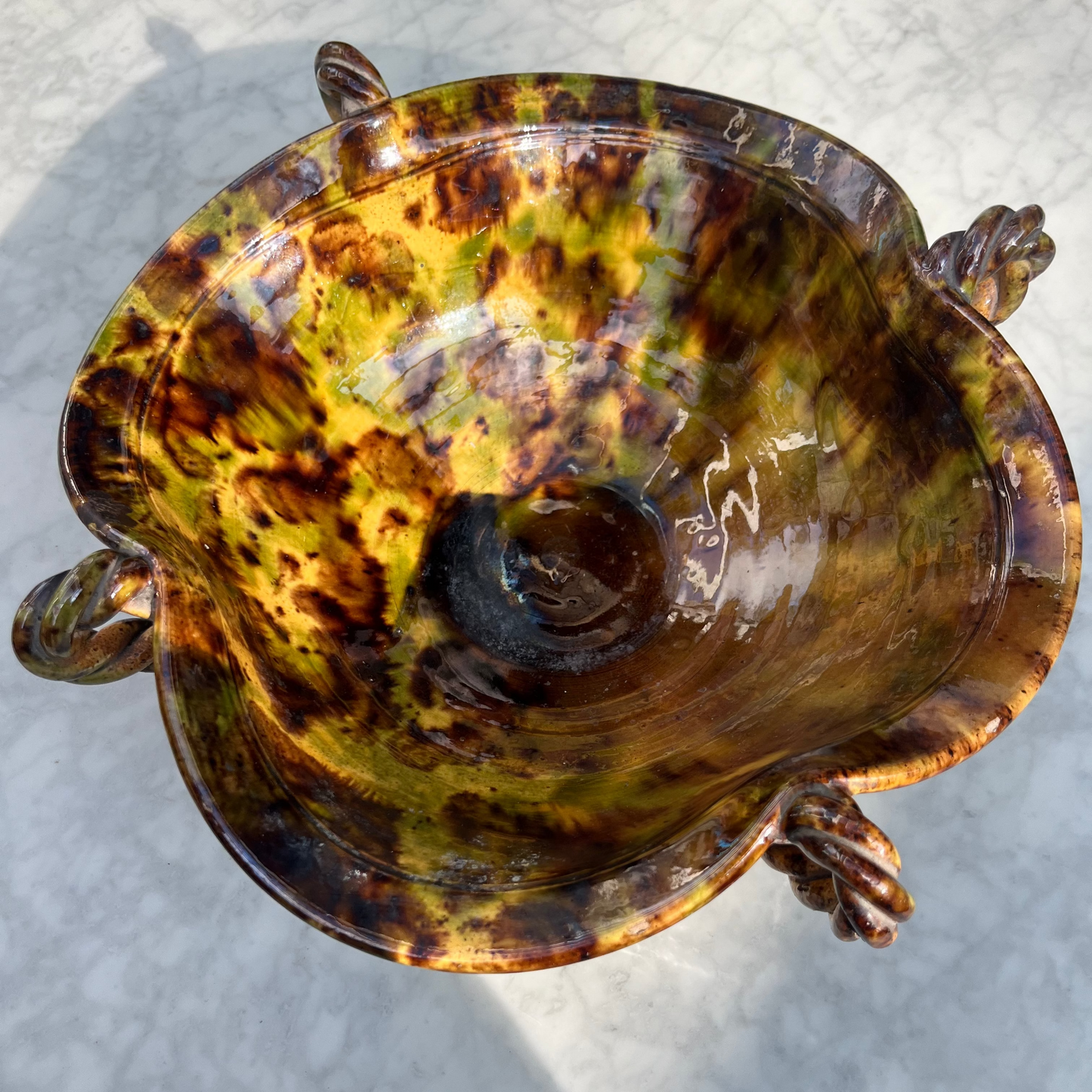 Vintage tortoiseshell ceramic bowl with twisted handle detailing