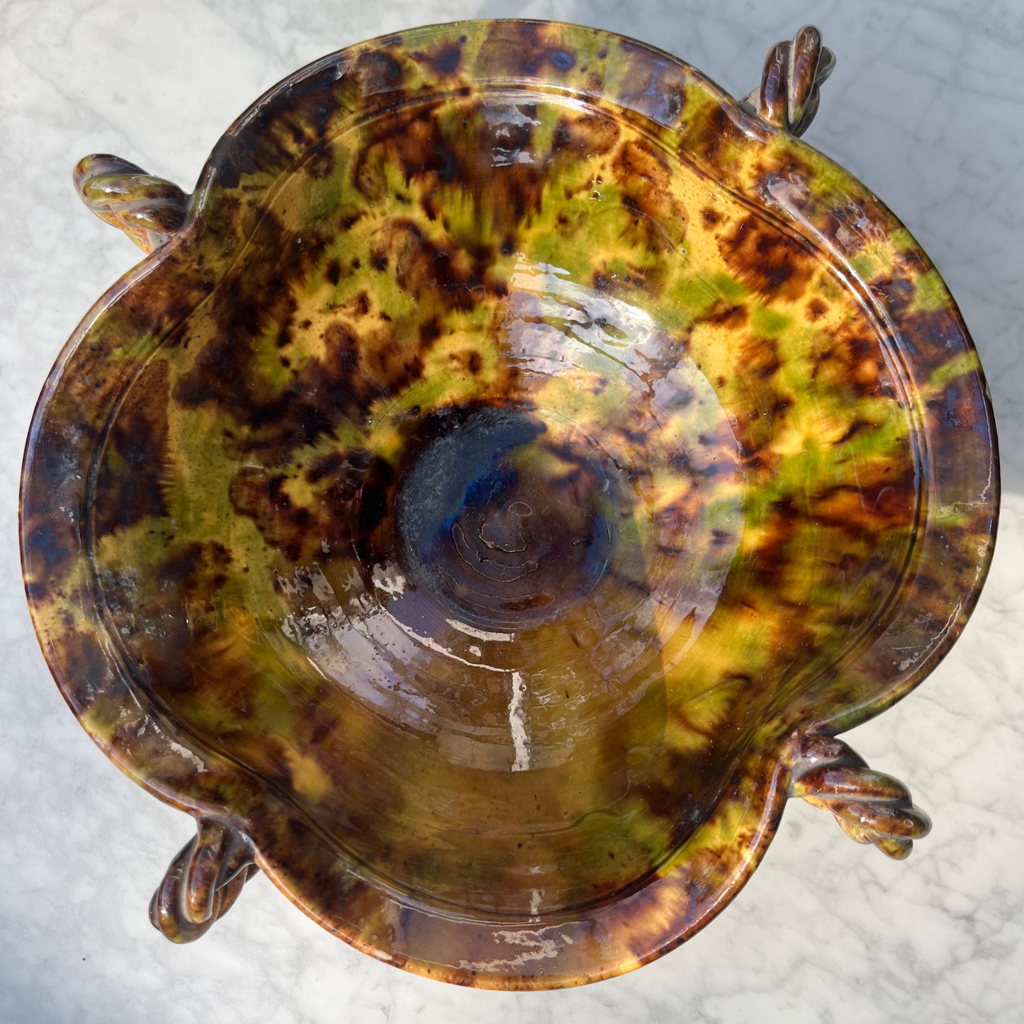 Vintage tortoiseshell ceramic bowl with twisted handle detailing